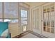 Bright sunroom with access to the backyard, featuring two doors and a comfortable seating area at 170 Habersham Dr, Fayetteville, GA 30214