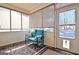 Inviting sunroom featuring a comfortable bench with decorative pillows, neutral tones, and natural light, perfect for relaxation at 170 Habersham Dr, Fayetteville, GA 30214