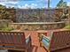 Relaxing outdoor seating area by a stone waterfall feature at 170 Habersham Dr, Fayetteville, GA 30214