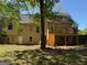 Lovely backyard view showcasing the wooden deck and the home's exterior at 11 Line Creek Cir, Sharpsburg, GA 30277
