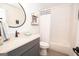 Clean bathroom with gray vanity, shower/tub combo, white tile and updated fixtures at 11 Line Creek Cir, Sharpsburg, GA 30277