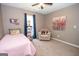 Comfortable bedroom with a single bed, plush armchair, soft lighting, and cozy décor at 11 Line Creek Cir, Sharpsburg, GA 30277