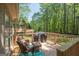 Cozy deck with outdoor seating, perfect for relaxing and enjoying the natural surroundings at 11 Line Creek Cir, Sharpsburg, GA 30277