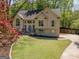 Beautiful two-story home with mature trees, landscaped yard, and a welcoming entrance at 11 Line Creek Cir, Sharpsburg, GA 30277