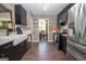 Modern kitchen with stainless steel appliances, sleek cabinets and a farmhouse sink at 11 Line Creek Cir, Sharpsburg, GA 30277