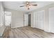 Spacious bedroom with ceiling fan, wood-look flooring, closet, and neutral walls at 2687 Fairfield Sw Dr, Marietta, GA 30064