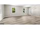 Bright bonus room featuring wood floors, natural light and neutral walls at 2687 Fairfield Sw Dr, Marietta, GA 30064