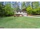Beautiful two-story home with an attached two-car garage and a lush green lawn at 2687 Fairfield Sw Dr, Marietta, GA 30064