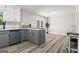 Kitchen with breakfast nook featuring gray cabinets, quartz countertops, recessed lighting, and wood-look flooring at 2687 Fairfield Sw Dr, Marietta, GA 30064