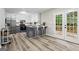 Charming kitchen features stainless steel appliances, island with bar seating, and french doors to outdoor deck at 2687 Fairfield Sw Dr, Marietta, GA 30064