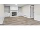 Living room with a fireplace, built-in shelves, and wood flooring at 2687 Fairfield Sw Dr, Marietta, GA 30064