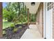 Charming covered porch with brick columns and view of landscaped front yard at 2687 Fairfield Sw Dr, Marietta, GA 30064