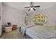 Cozy bedroom with ceiling fan, closet, shelving, and a TV for personal enjoyment and space at 2810 Jodeco Ter, Jonesboro, GA 30236