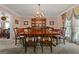 Formal dining room with wooden table, upholstered chairs, and elegant china cabinet at 2810 Jodeco Ter, Jonesboro, GA 30236