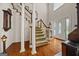Elegant foyer with hardwood floors, a staircase, and a decorative front door with stained glass at 2810 Jodeco Ter, Jonesboro, GA 30236