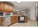 This kitchen features wooden cabinets, stainless steel appliances, and an open view to the adjacent living space at 2810 Jodeco Ter, Jonesboro, GA 30236