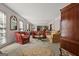 Formal living room with mirrored wall, ornate furniture, and round rug on carpet at 2810 Jodeco Ter, Jonesboro, GA 30236