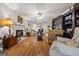 Living room featuring hardwood floors, fireplace, and traditional furnishings at 2810 Jodeco Ter, Jonesboro, GA 30236