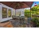 Enjoy outdoor gatherings on this covered patio, featuring a rustic metal table and chairs for relaxing at 2810 Jodeco Ter, Jonesboro, GA 30236