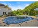 Backyard pool features a covered pool, outdoor seating, and greenery in a private setting at 2810 Jodeco Ter, Jonesboro, GA 30236