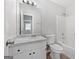 Well-lit bathroom featuring a single vanity and combined bathtub and shower at 11203 Hemlock Rd, Hampton, GA 30228