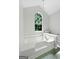 Relaxing bathroom showcasing a large garden tub with a view from the arched window at 11203 Hemlock Rd, Hampton, GA 30228