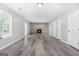Spacious living room with stone fireplace, neutral paint, and ample natural light at 11203 Hemlock Rd, Hampton, GA 30228