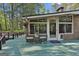 Outdoor living space on the back deck with seating and access to the home's interior at 120 Tall Pine Dr, Fayetteville, GA 30214