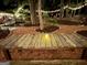 Tranquil backyard setting with a picnic table, landscape lighting and meandering pathways at 120 Tall Pine Dr, Fayetteville, GA 30214