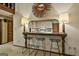 Stylish bar area features seating, lighting, and is open to the adjacent kitchen at 120 Tall Pine Dr, Fayetteville, GA 30214