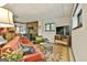 Spacious finished basement featuring vintage decor, a wood-burning stove, and comfortable seating area at 120 Tall Pine Dr, Fayetteville, GA 30214