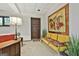 Finished basement featuring a yellow sofa, decorative artwork, and a stylish mid-century modern design at 120 Tall Pine Dr, Fayetteville, GA 30214