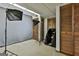 Unfinished basement space with lighting equipment, neutral backdrop, and ample storage space at 120 Tall Pine Dr, Fayetteville, GA 30214