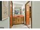 Bathroom with wooden cabinets, red countertops, and a view into the shower at 120 Tall Pine Dr, Fayetteville, GA 30214