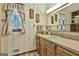 Classic bathroom featuring vintage wallpaper, window with curtains, and neutral color palette at 120 Tall Pine Dr, Fayetteville, GA 30214