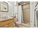 Retro bathroom with a pink sink, toilet, and a tiled shower, offering a vintage aesthetic at 120 Tall Pine Dr, Fayetteville, GA 30214