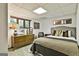 Cozy bedroom featuring a comfortable bed, vintage mid-century modern dresser, and ample natural light at 120 Tall Pine Dr, Fayetteville, GA 30214