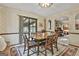 Dining area with traditional table, chairs and sliding door to the outside at 120 Tall Pine Dr, Fayetteville, GA 30214