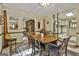 Spacious dining room with traditional table, chairs and view to the living room fireplace at 120 Tall Pine Dr, Fayetteville, GA 30214