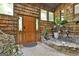 Unique foyer featuring wood paneled walls, tile floors, and a wooden front door at 120 Tall Pine Dr, Fayetteville, GA 30214