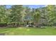 Inviting brick home showcases mature landscaping, well-manicured greenery, and a serene setting at 120 Tall Pine Dr, Fayetteville, GA 30214
