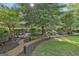 Front yard with mature landscaping, rock walls, mulch, and sunny exposure at 120 Tall Pine Dr, Fayetteville, GA 30214