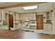 Traditional kitchen with off-white cabinets, sage countertops, and stainless steel sink at 120 Tall Pine Dr, Fayetteville, GA 30214