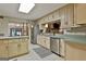 Spacious kitchen with stainless steel appliances and sage colored countertops at 120 Tall Pine Dr, Fayetteville, GA 30214