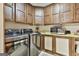 Well-equipped laundry room featuring a modern washer and dryer set and ample cabinet storage above and below the countertop at 120 Tall Pine Dr, Fayetteville, GA 30214