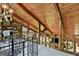 Loft area with exposed beams and overlooking the main living space at 120 Tall Pine Dr, Fayetteville, GA 30214