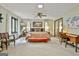 Light-filled main bedroom with large windows, ceiling fan, and neutral decor at 120 Tall Pine Dr, Fayetteville, GA 30214