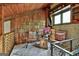 Charming upstairs sitting area with wood walls, a window seat, and cozy decor at 120 Tall Pine Dr, Fayetteville, GA 30214