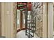 Unique spiral staircase features stone and wood finishes, offering a rustic charm at 120 Tall Pine Dr, Fayetteville, GA 30214