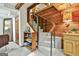 Carpeted staircase with wooden railings and paneled walls, complemented by rustic decor and a cozy, inviting ambiance at 120 Tall Pine Dr, Fayetteville, GA 30214